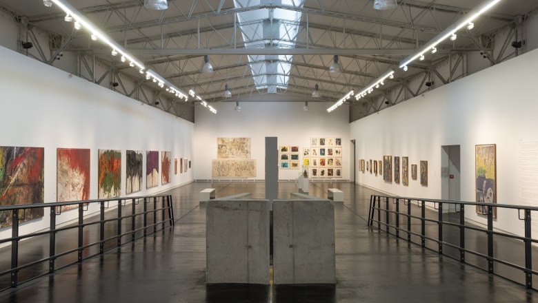 nitsch museum, © Josef Schimmer Interior view of the Nitsch Museum with paintings on the walls and modern architecture.