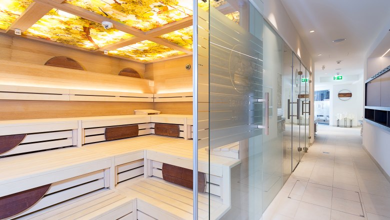 Spa area, © Althof Retz / Tschank Interior view of a modern spa area with sauna and glass door.