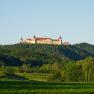 View of Göttweig Abbey on a wooded hill.