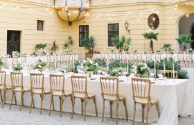 Inner courtyard of Eckartsau Castle with festively laid tables and fairy lights.