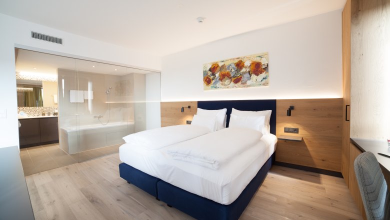 Hotel room with double bed and bathroom