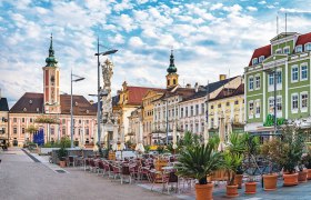 Town Hall Square in St. Pölten with historic buildings and outdoor seating area.