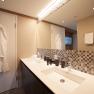 Bathroom with washbasin and bathrobe