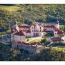 Aerial view of Göttweig Abbey in Austria, surrounded by forest.