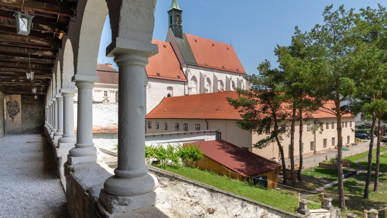 View of the Capuchin church in Wiener Neustadt with arcades in the foreground.