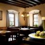 Cozy restaurant with wooden furniture, beer and dumplings on a table.