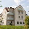 Exterior view of the Hotel Restaurant Donauhof with balconies and garden.