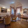 Elegant salon in Hotel Schloss D&uuml;rnstein with antique furniture, paintings and books.