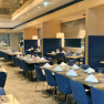 A modern restaurant with blue chairs, interior view