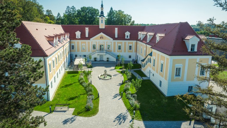 Aerial view of Haindorf Castle with inner courtyard and garden.