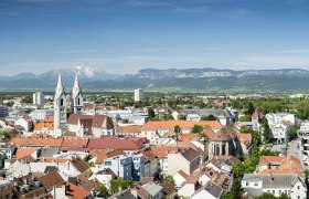 Panorama of Wiener Neustadt with mountains in the background.