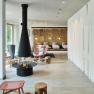 Modern lounge area with fireplace and armchairs at the Steigenberger Krems.