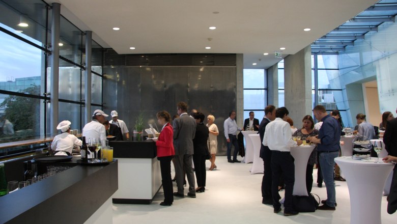 People at a reception in the Festspielhaus St. Pölten.