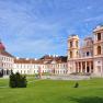 Göttweig Abbey with its baroque architecture and green forecourt under a blue sky.