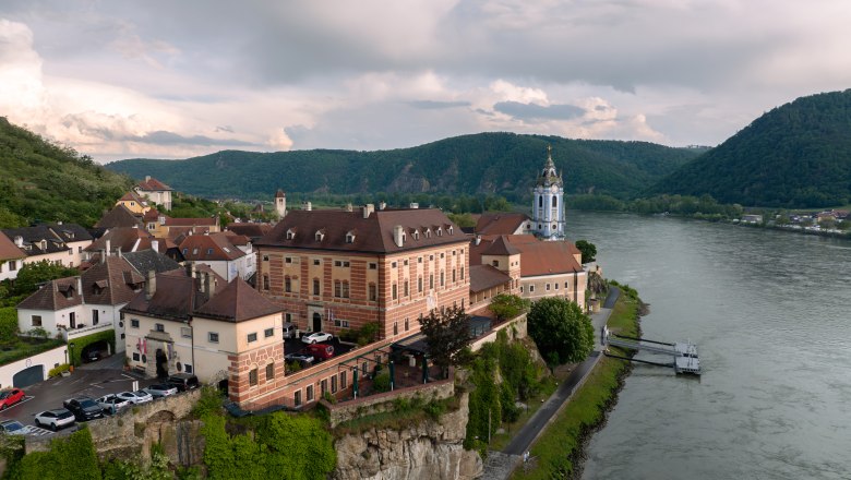Aerial view of D&uuml;rnstein Castle on the Danube with surrounding landscape.
