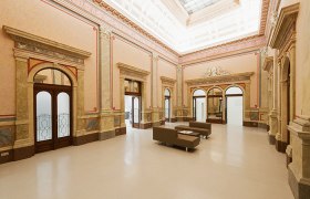 Interior view of the Arnulf Rainer Museum with elegant architecture and seating.