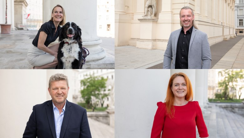 Four people pose in front of a historic building, a woman with a dog, two men and a woman in a red dress.