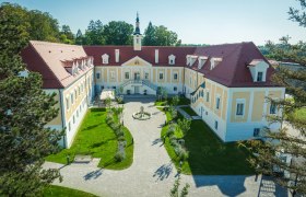 Aerial view of Haindorf Castle with inner courtyard and garden.