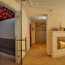 An elegant wellness area with fireplace, candles and sauna.