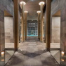 Interior view of an elegant spa area with pillars and candles.