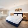 Hotel room with double bed and bathroom