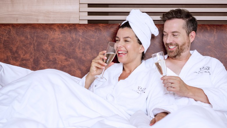 Double room, couple drinking champagne